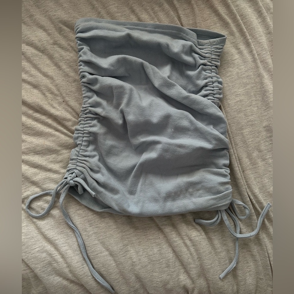 Baby blue ruched mini skirt. Strings make skirt adjustable for length. Size S